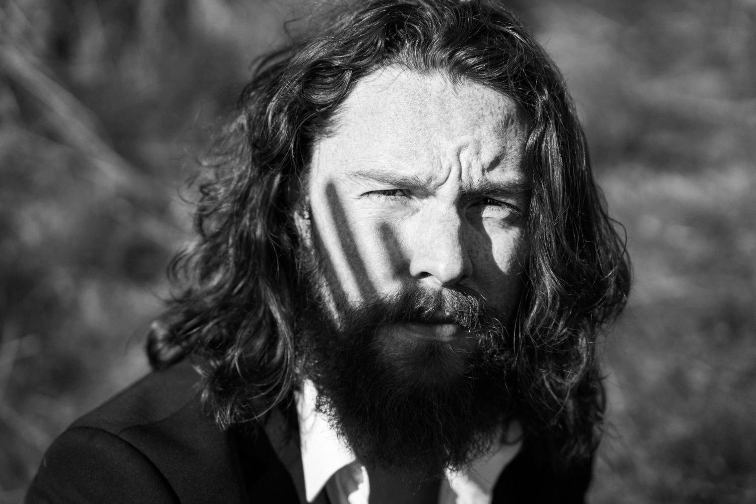Black and white artistic portrait shot with dramatic lighting and shadows. PHOTOGRAPHER Dublin