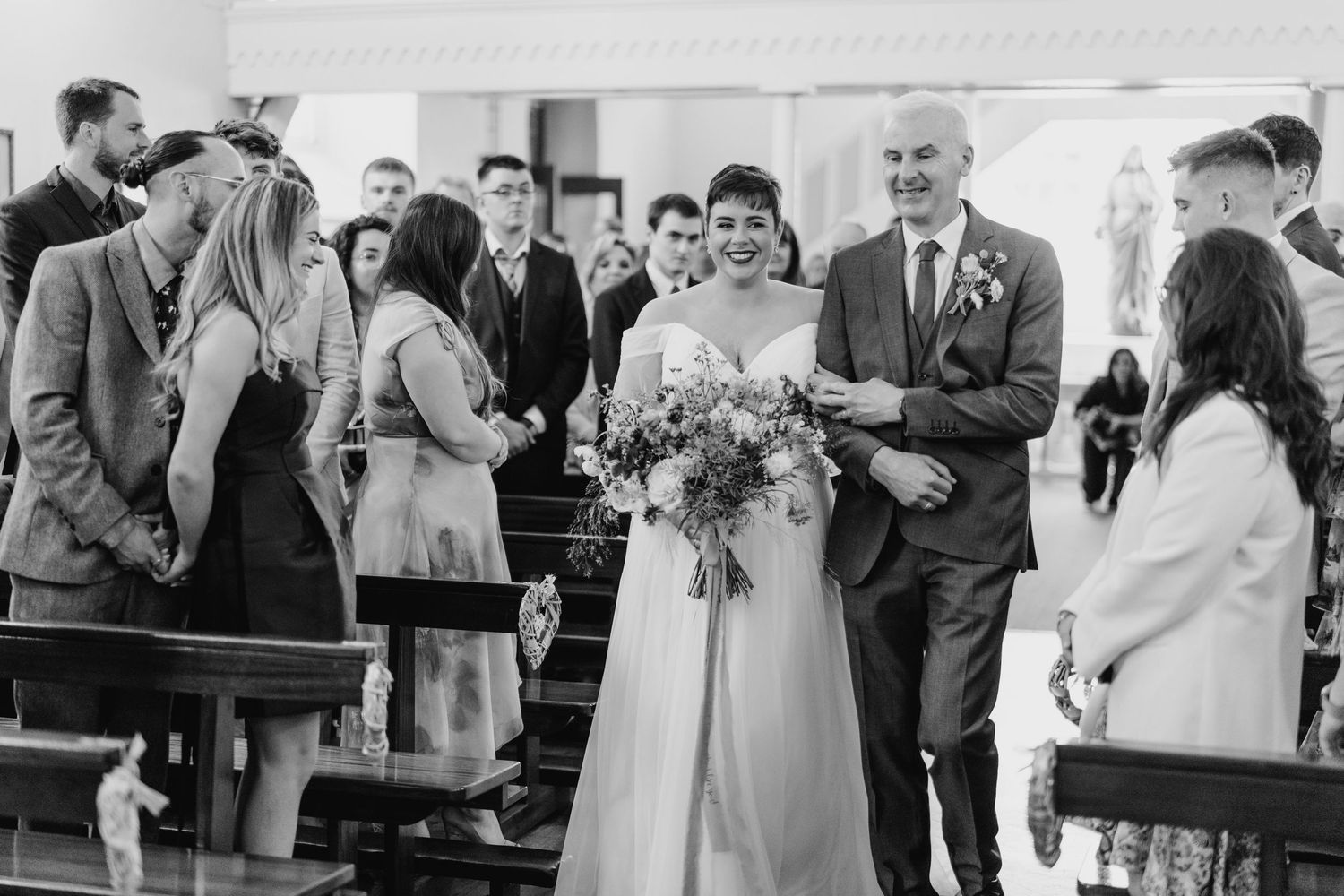 Millhouse slane wedding photographer dublin Black and white photo capturing intimate wedding ceremony moment indoors.