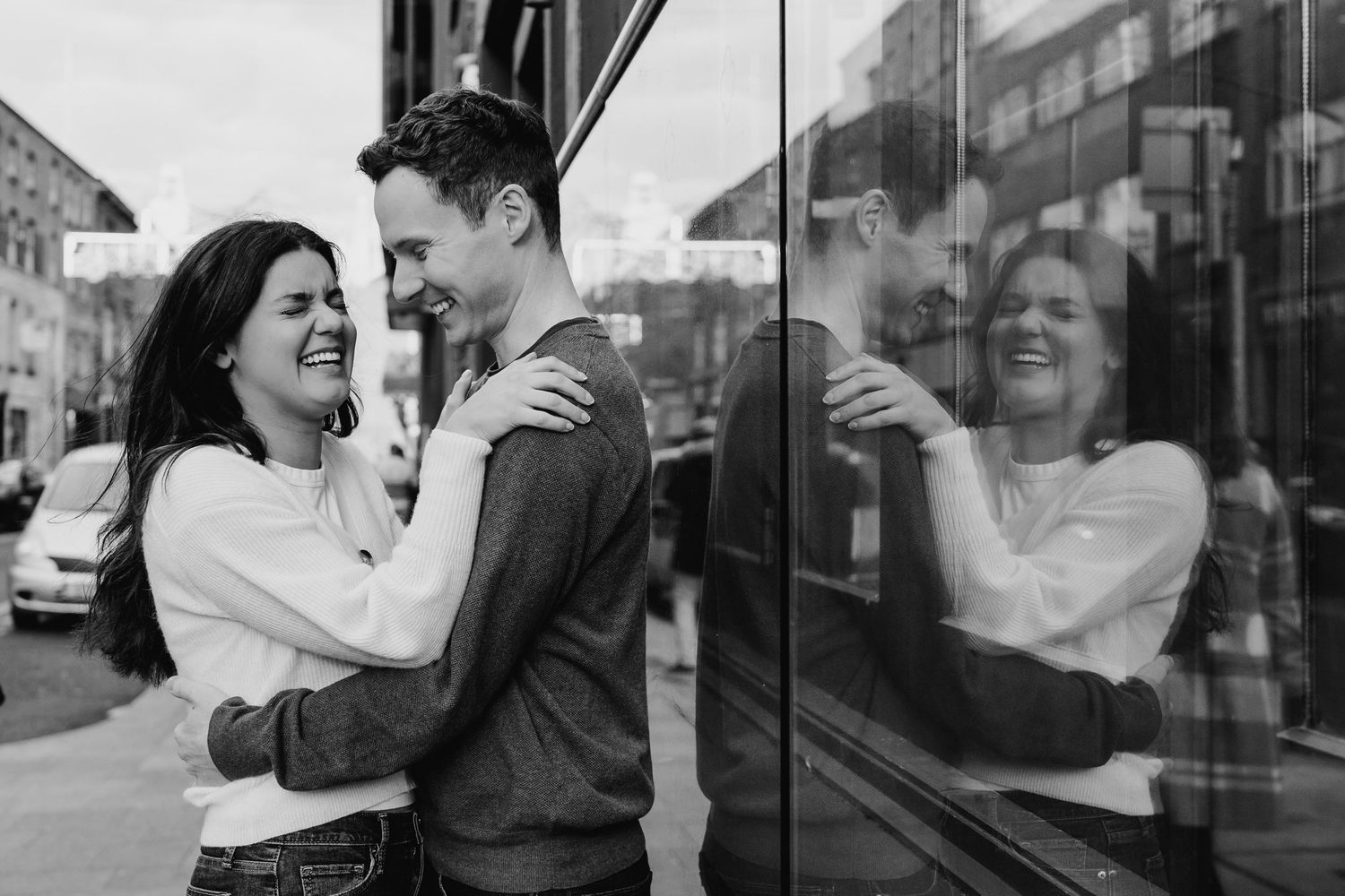 A series of candid romantic moments captured between a couple against an urban backdrop. Surprise proposal dublin photography