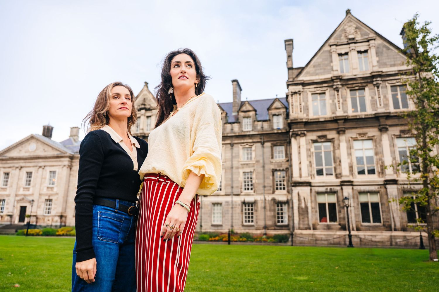Fashion portraits on cobblestone path with historic stone buildings in background. professional headshots dublin photographer