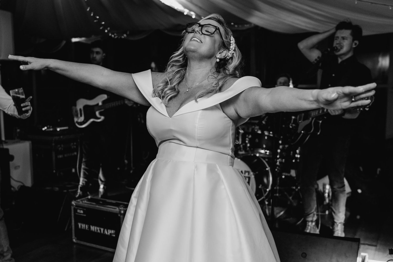 Wedding celebration dance floor with guests dancing under romantic string lights.  Virginia Park Lodge Wedding Photographer Cavan Dublin Ire
