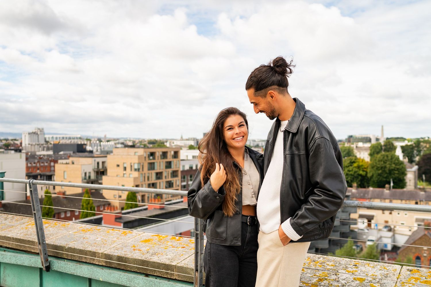 Rooftop scene showing building skyline and urban landscape on a cloudy day. Couple's Photoshoot PHOTOGRAPHER Dublin