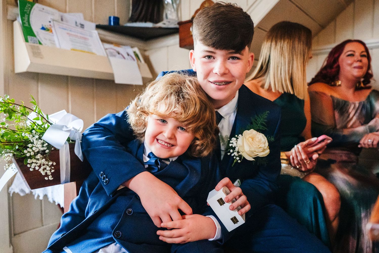 Two people in formal attire share a joyful embrace during a wedding celebration. The Dean Dublin Wedding Photographer