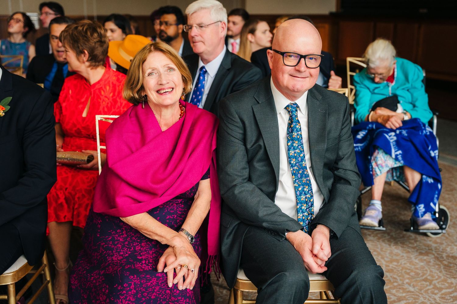 Wedding guests in formal attire enjoying themselves during a celebration. Wedding Photography Trim Castle Ireland