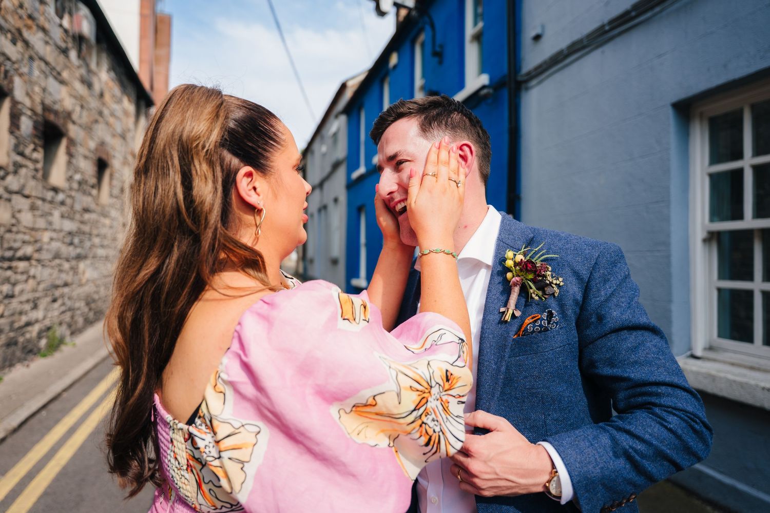 Wedding guests share laughs and celebrate during outdoor summer reception. Same sex wedding PHOTOGRAPHER Dublin