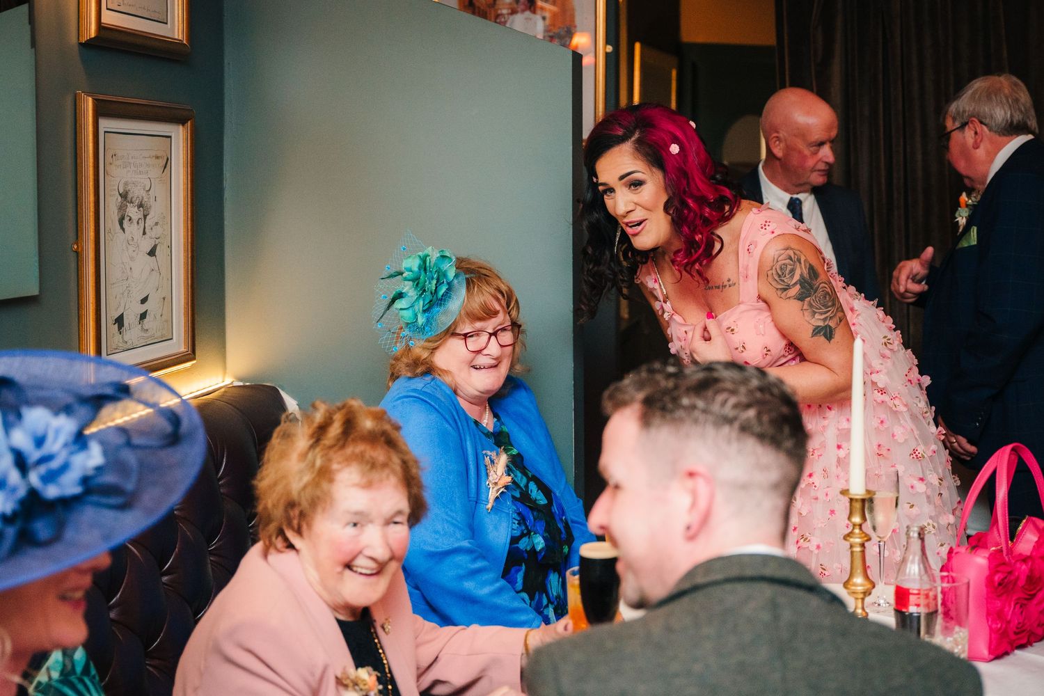 Guests enjoying themselves at a colorful indoor party venue. Marco Pierre Dublin Wedding Photographer
