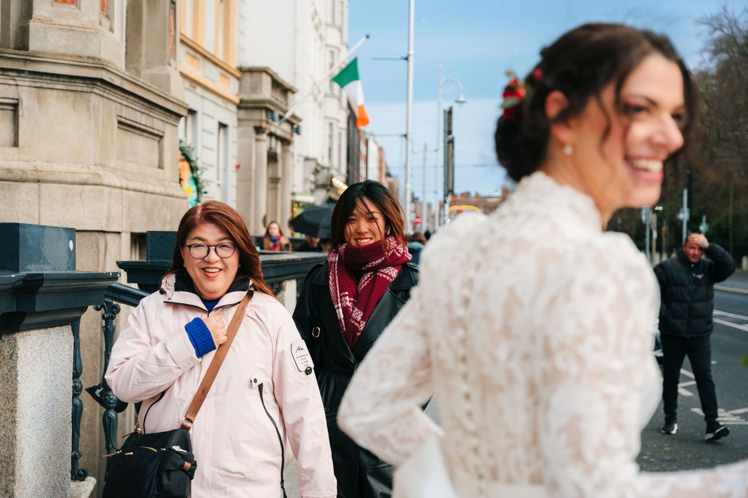 A sequence of candid street photography moments showing people walking and interacting in an urban setting. Wedding photographer dublin
