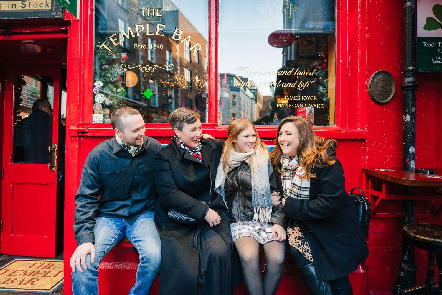 Family walking through Dublin city centre during a relaxed vacation photo session with a family photographer Dublin temple bar