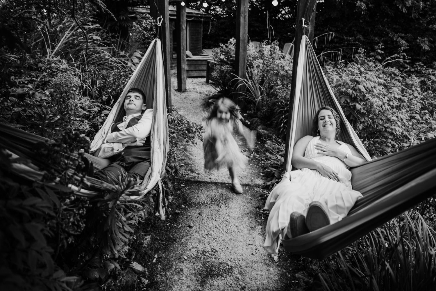 A relaxing scene of someone lounging in a hammock surrounded by lush garden greenery and natural light. wedding photographer dublin pricing