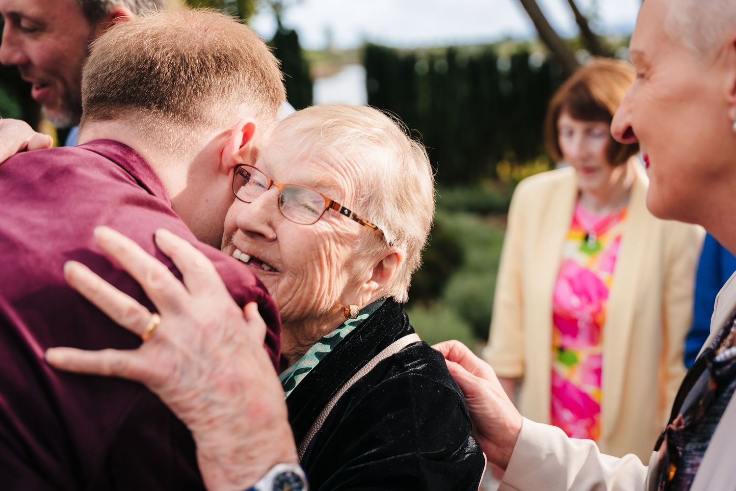 A series of candid wedding photos showing guests laughing and reacting joyfully during an outdoor celebration. Wedding photographer dublin