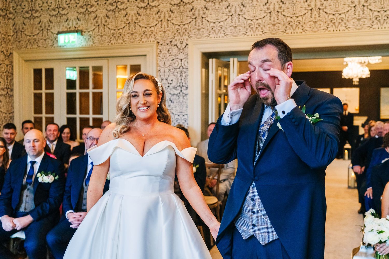 A joyful couple sharing an emotional moment during their wedding ceremony.  Virginia Park Lodge Wedding Photographer Cavan Dublin Ireland