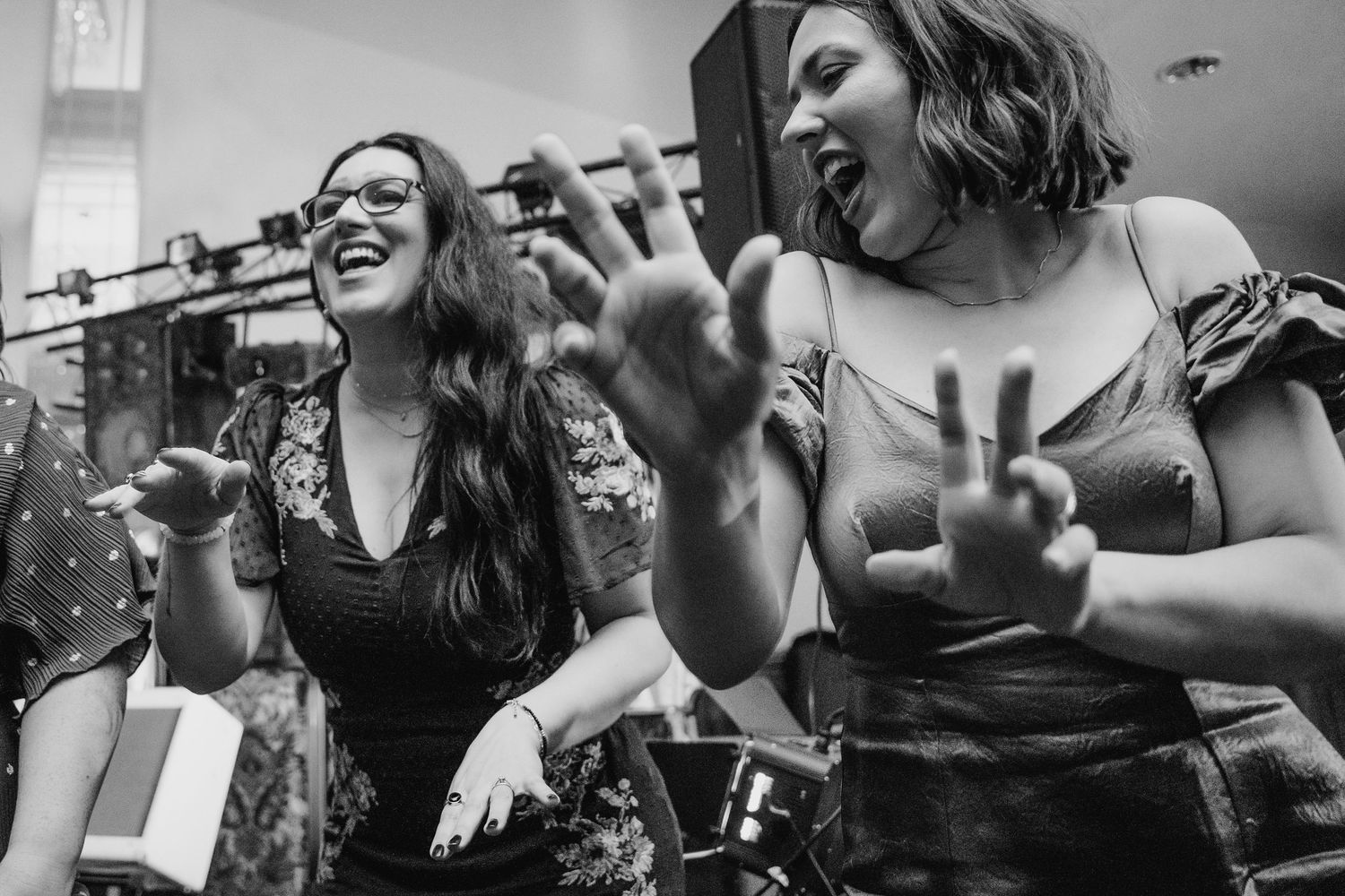 Black and white photo of wedding guests dancing and celebrating with joyful expressions.Wedding Photography Trim Castle Ireland