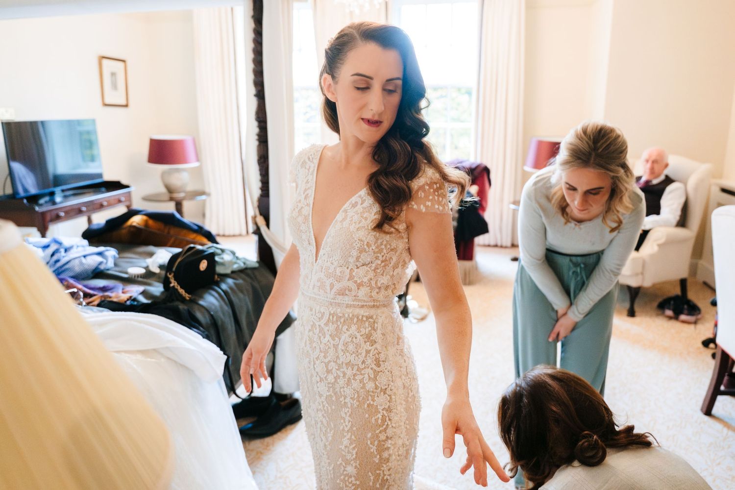 A series of candid getting-ready moments shown in warm-toned photos of wedding preparations.
