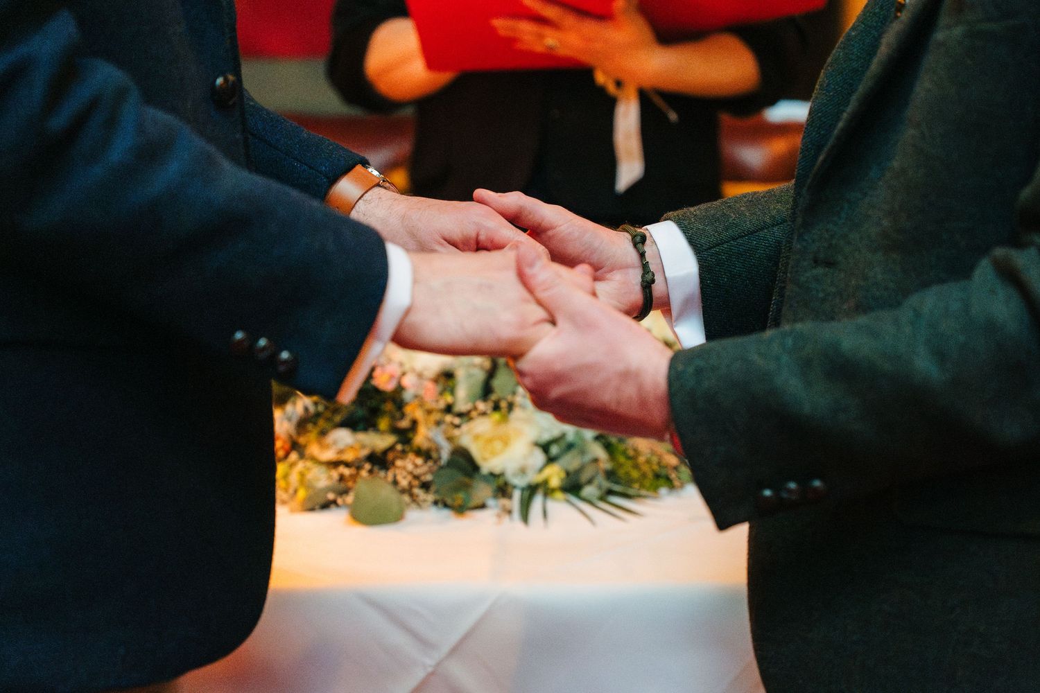 Wedding party guests share casual conversation and laughter during a reception celebration. Marco Pierre Dublin Wedding Photographer