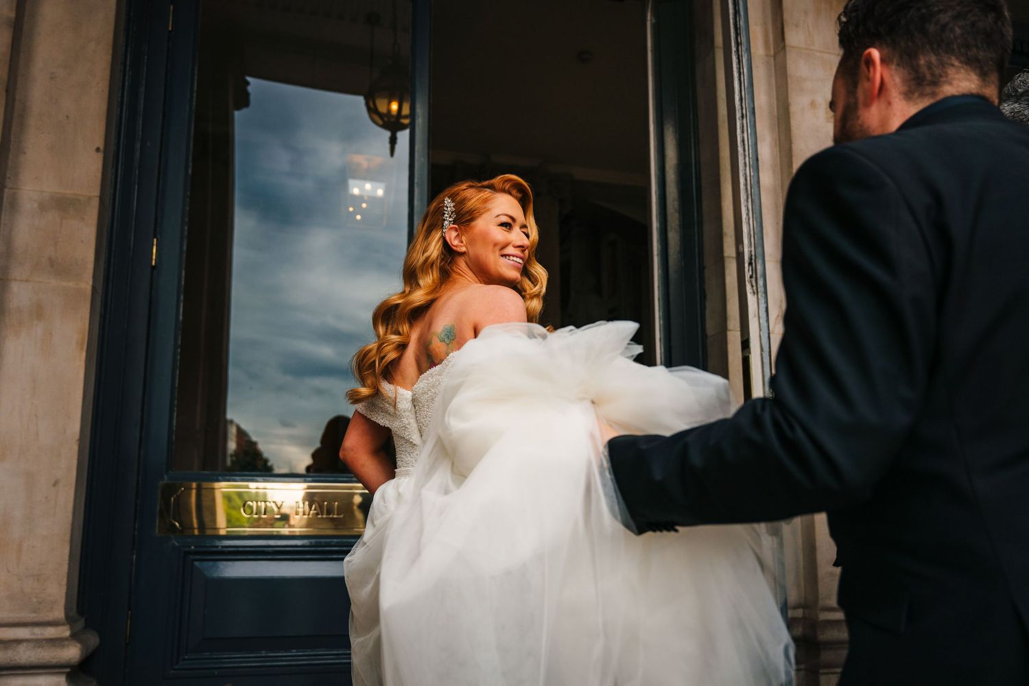 Romantic wedding portraits captured against classic architectural details at dusk.  city hall dublin wedding photos