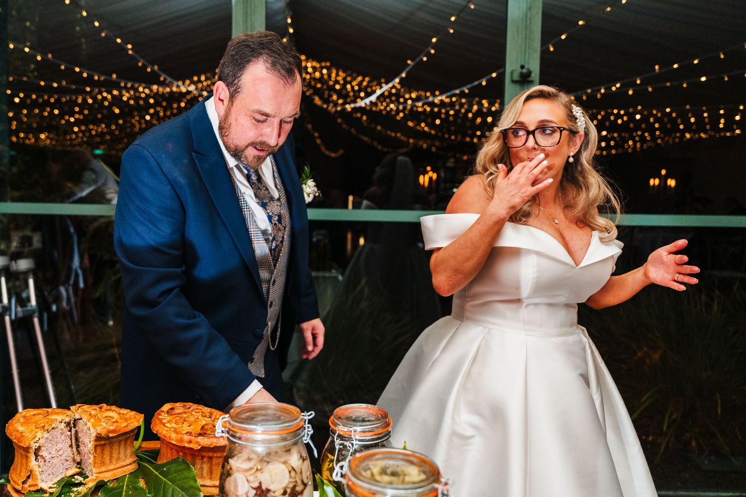 Wedding reception dinner features string lights and intimate table settings.  Virginia Park Lodge Wedding Photographer Cavan Dublin Ireland