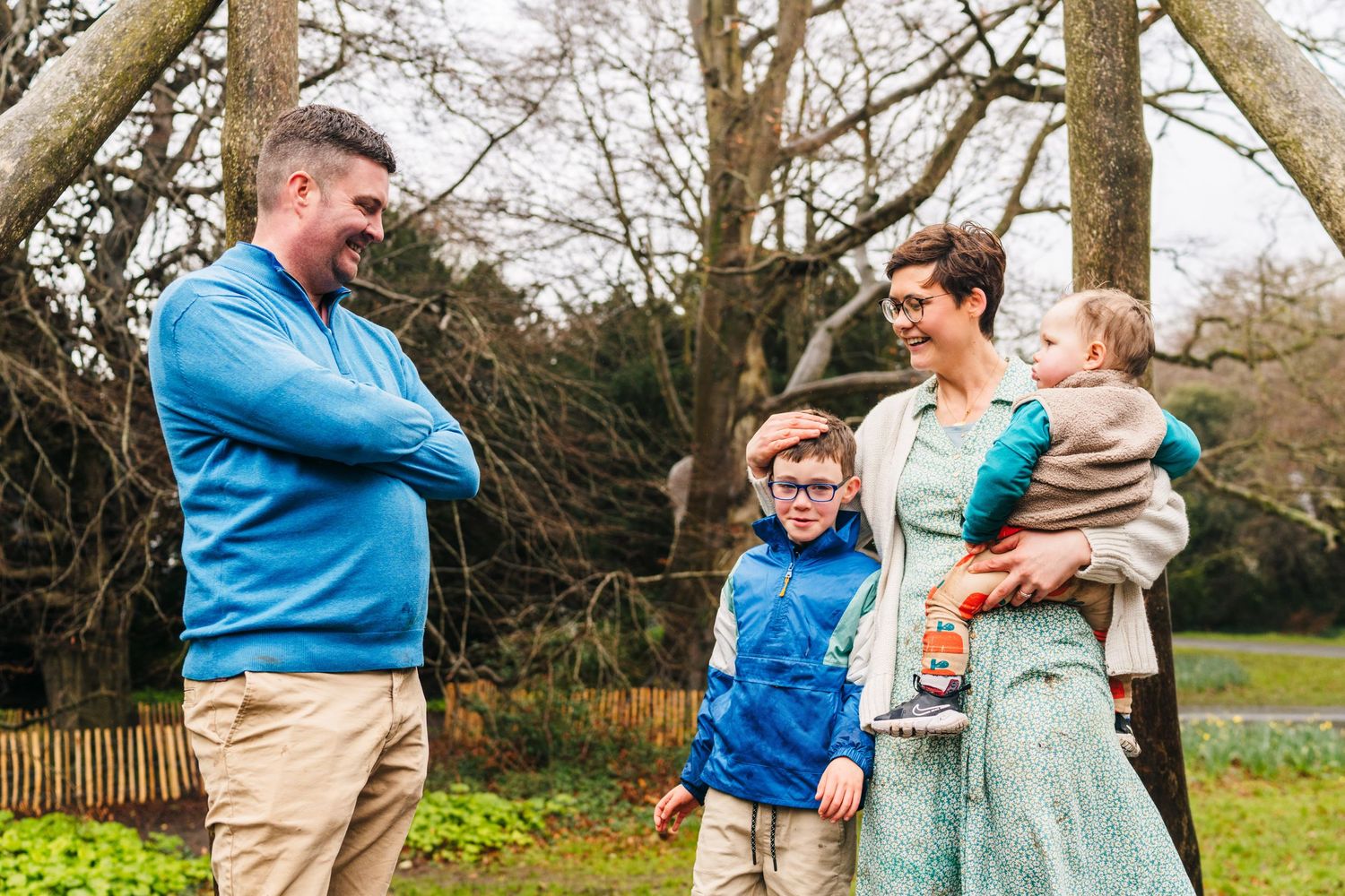 Family photographer Dublin Ireland  A family spending quality time together at park on an overcast day.