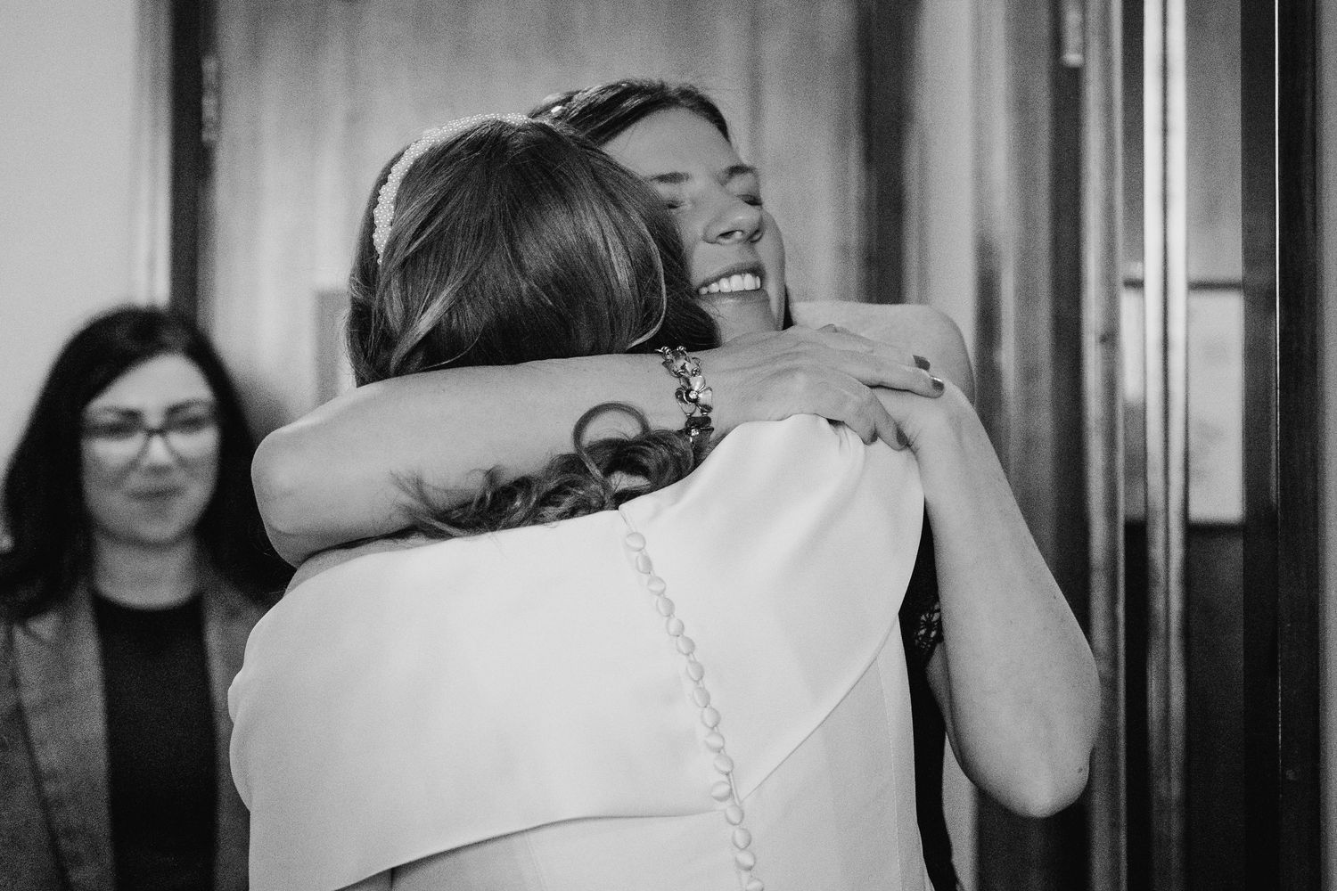 Emotional black and white hospital photos capturing the tender moments after childbirth with medical staff.  Wedding PHOTOGRAPHER Trim Castl