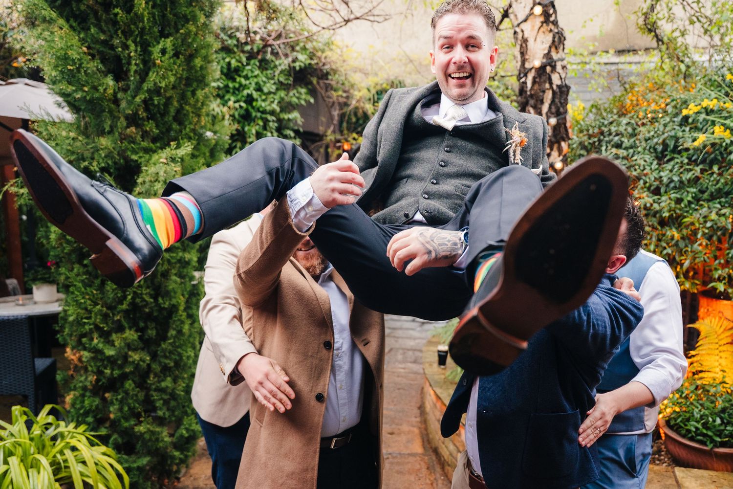 Wedding guests sharing drinks and laughter during an outdoor celebration.Marco Pierre Dublin Wedding Photographer