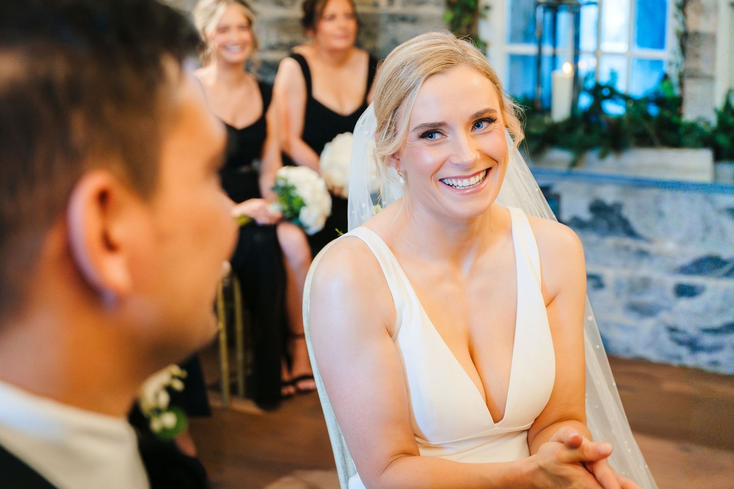 A happy couple shares joyful moments during their wedding celebration at an indoor venue. Ballymagarvey Wedding photographer