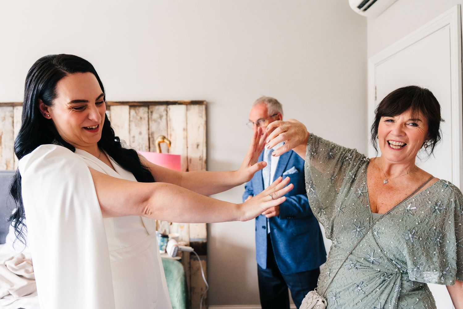 Wedding guests laugh and share joyful moments during a daytime reception celebration. House Dublin Wedding Photographer