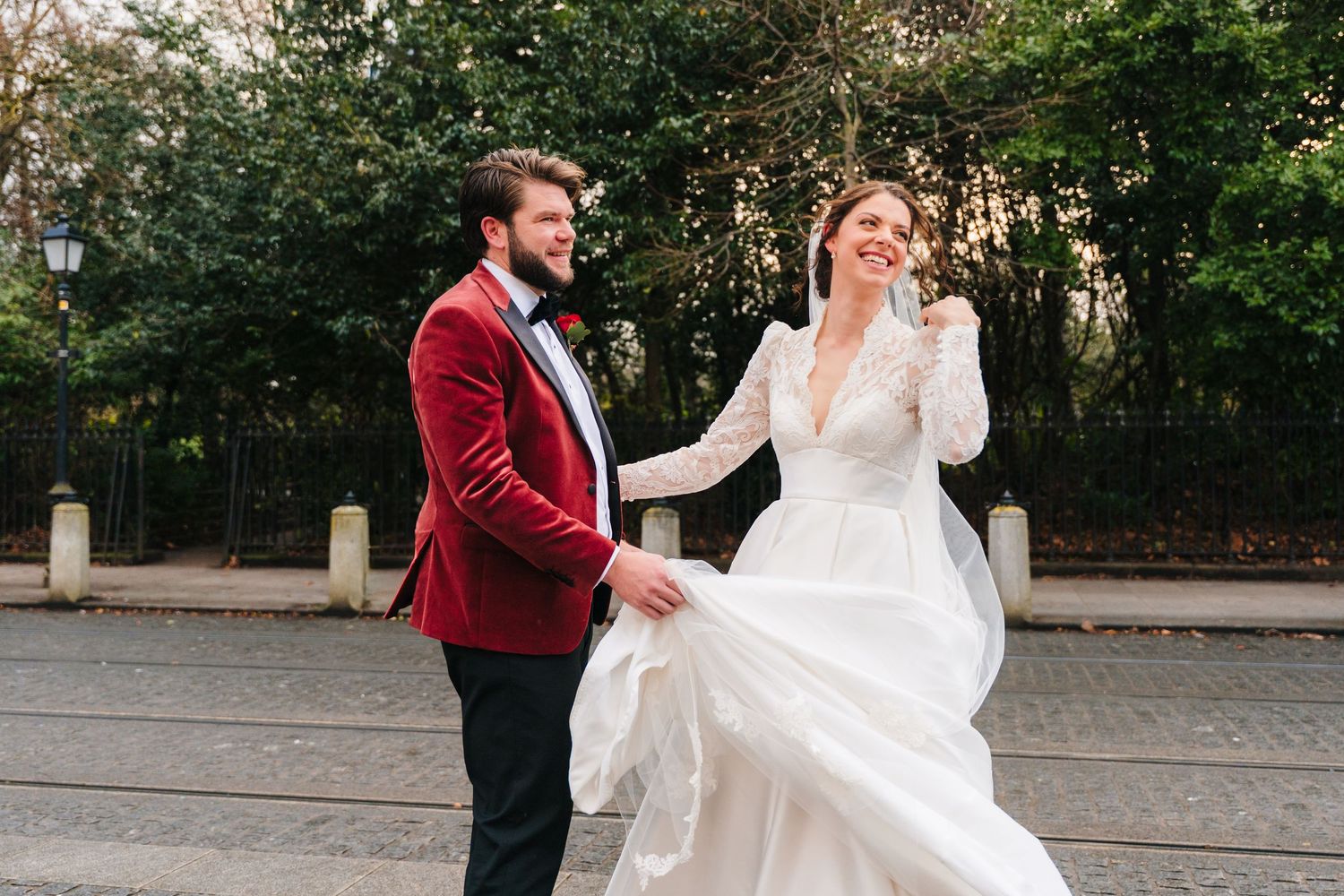A couple shares their first dance as newlyweds on an outdoor paved area during their wedding celebration. Stephens green club dublin Wedding