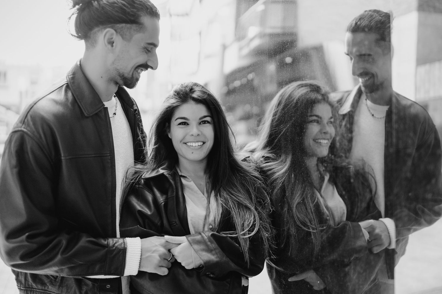 Black and white montage showing candid couple moments in an urban setting, showing affection and laughter. Couple's Photoshoot PHOTOGRAPHER