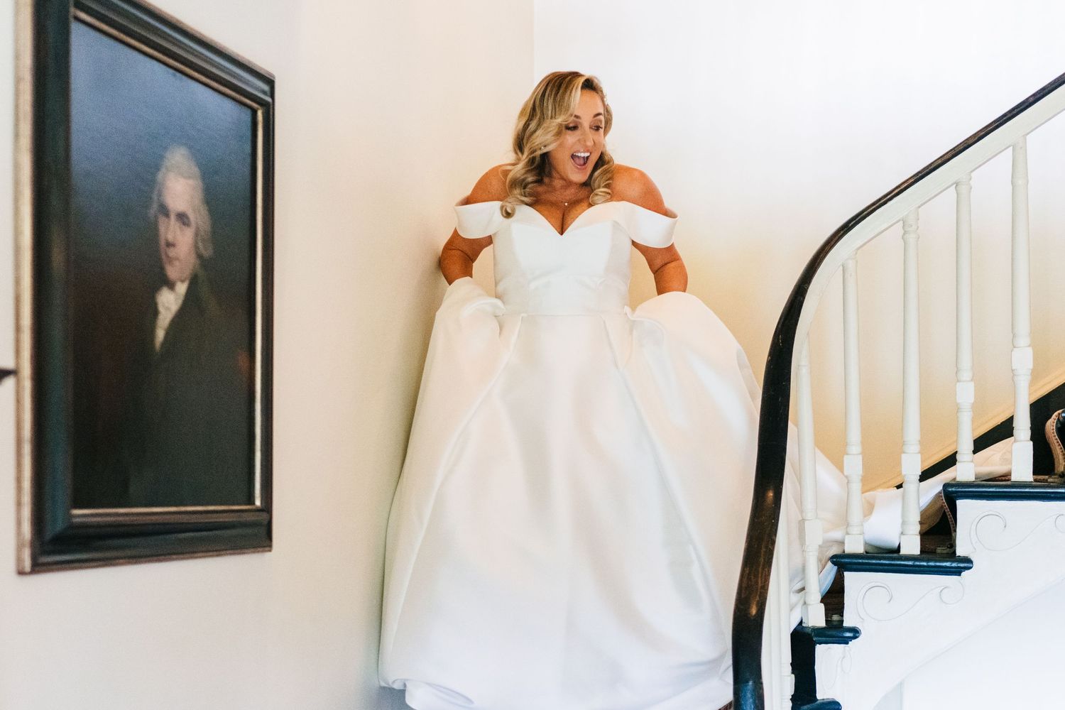 Wedding dress with off-shoulder neckline and full skirt in a room with classic decor.  Virginia Park Lodge Wedding Photographer Cavan Dublin