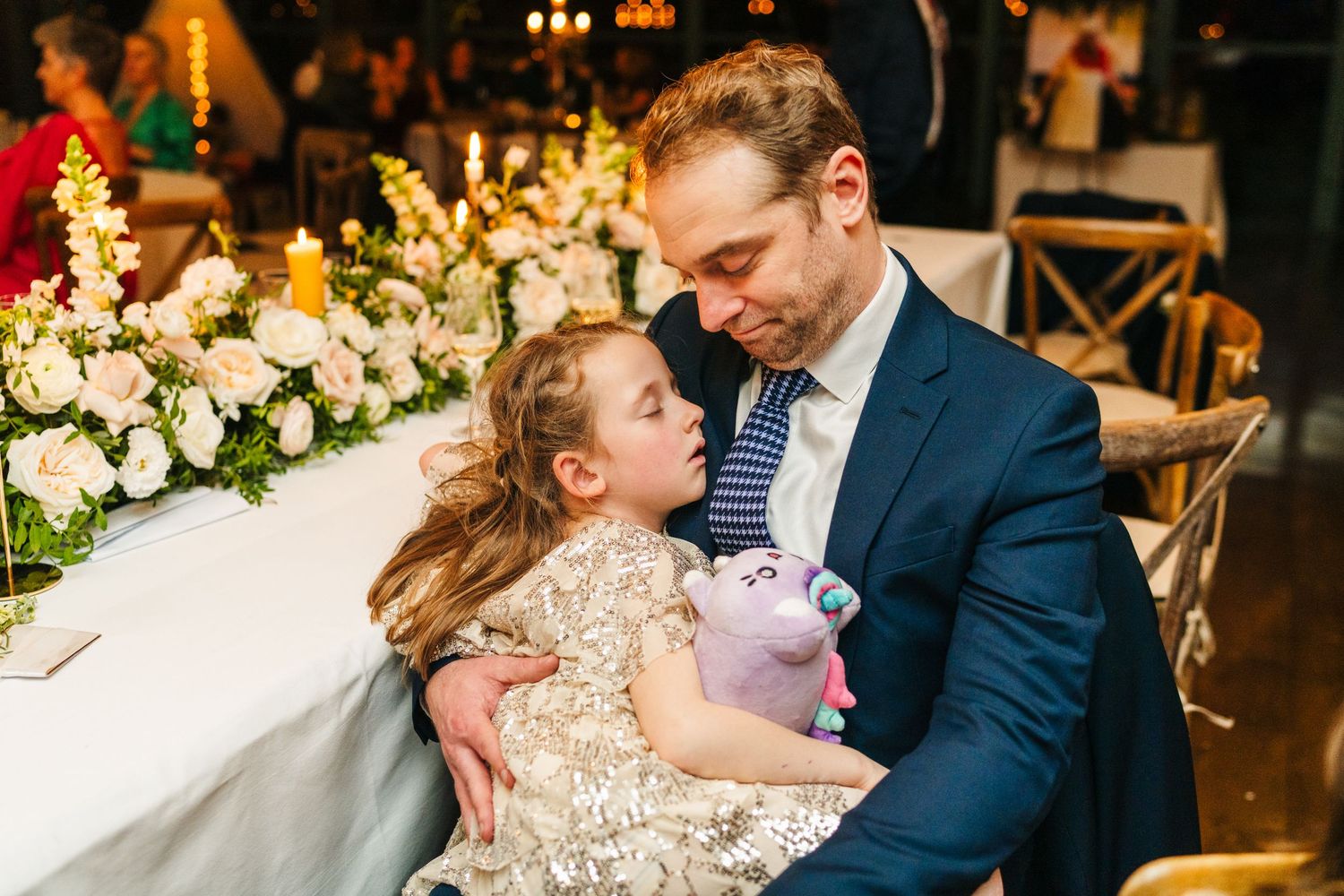 Elegant wedding reception decorated with floral arrangements and warm ambient lighting.  Virginia Park Lodge Wedding Photographer Cavan Dubl