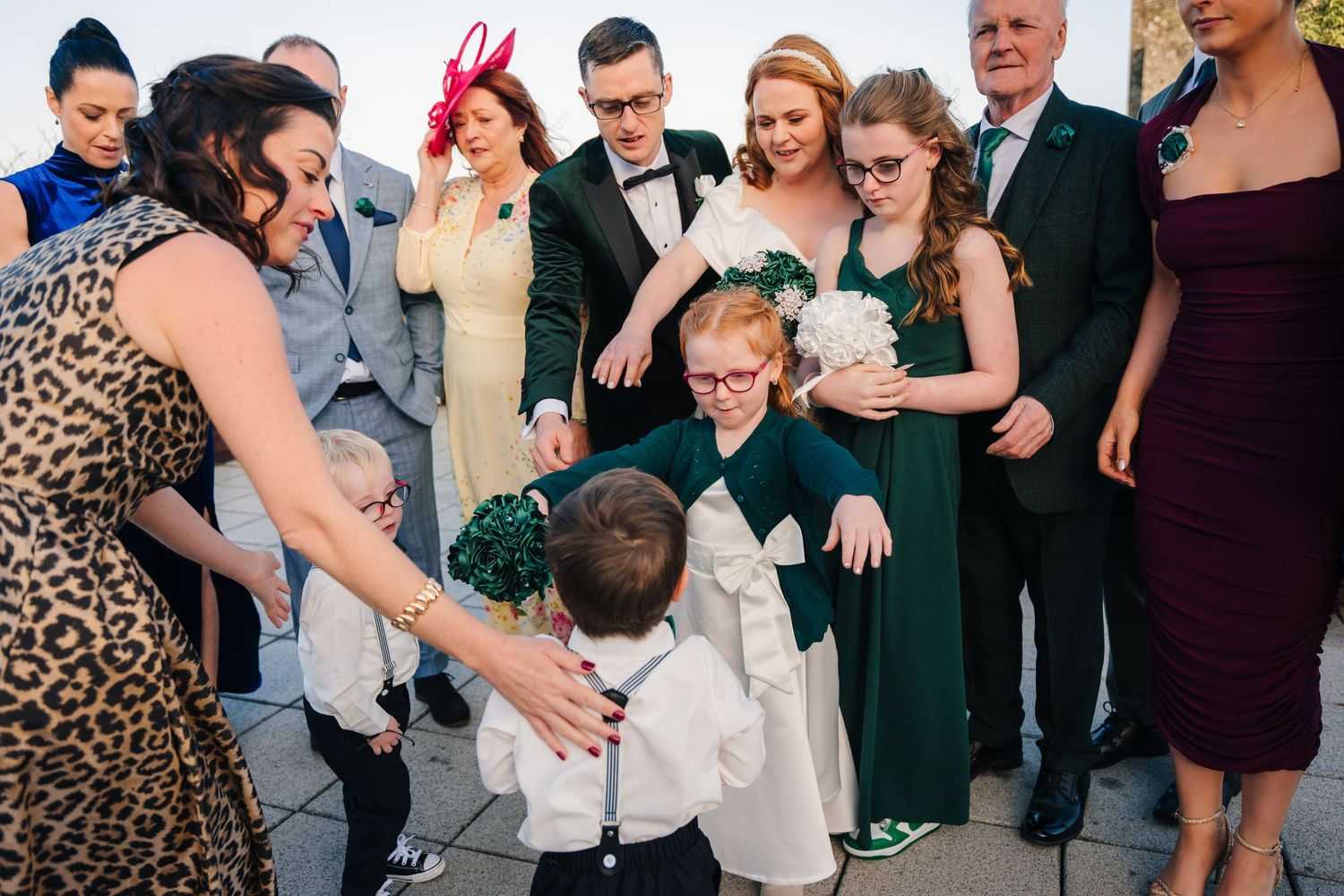 Wedding guests sharing emotional moments and hugs during celebration.  Wedding PHOTOGRAPHER Trim Castle