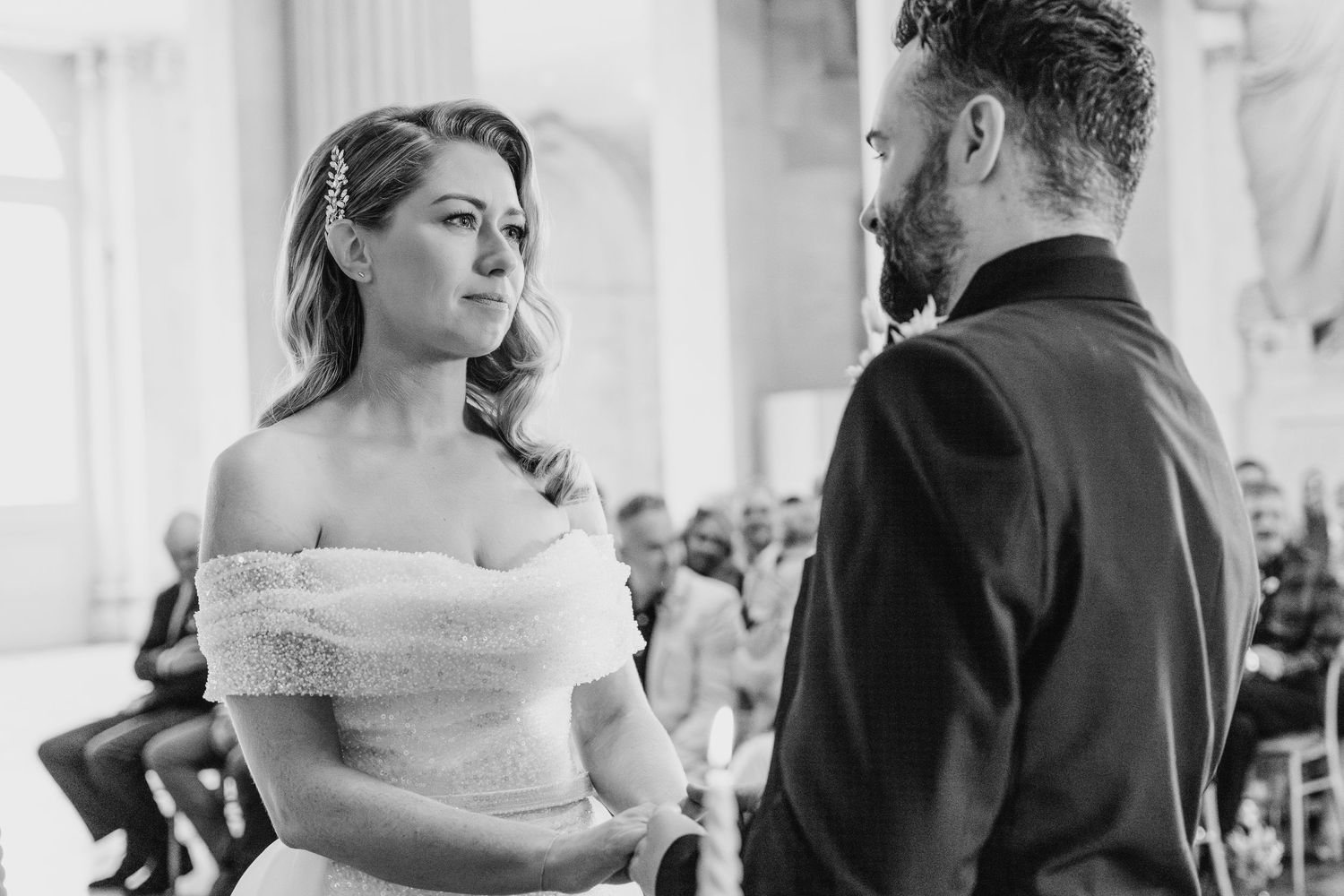 Black and white intimate wedding ceremony moment in a grand columned venue.  city hall dublin wedding photos