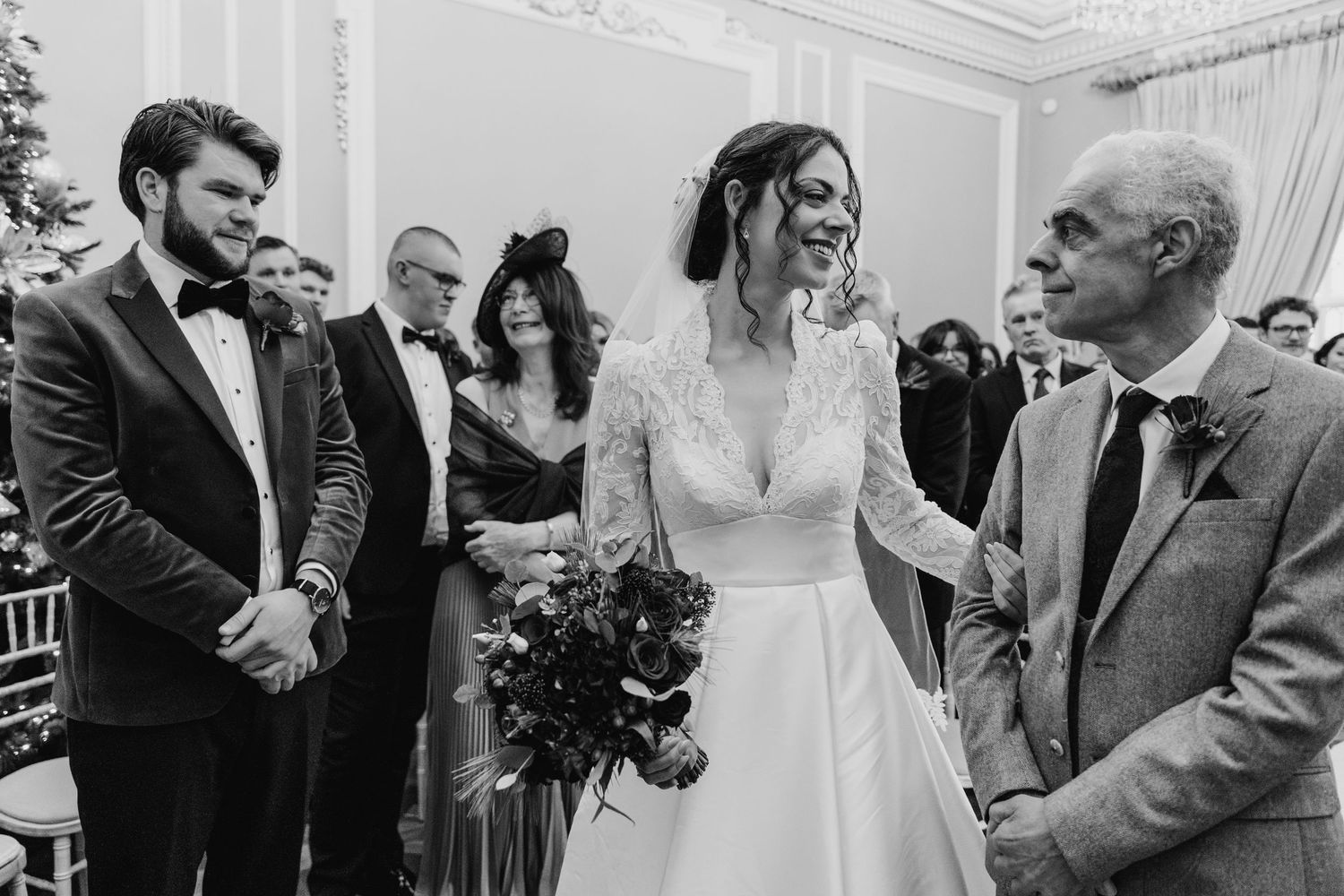 A series of black and white wedding celebration photos showing joyful moments during a reception. Stephens green club dublin Wedding photogr