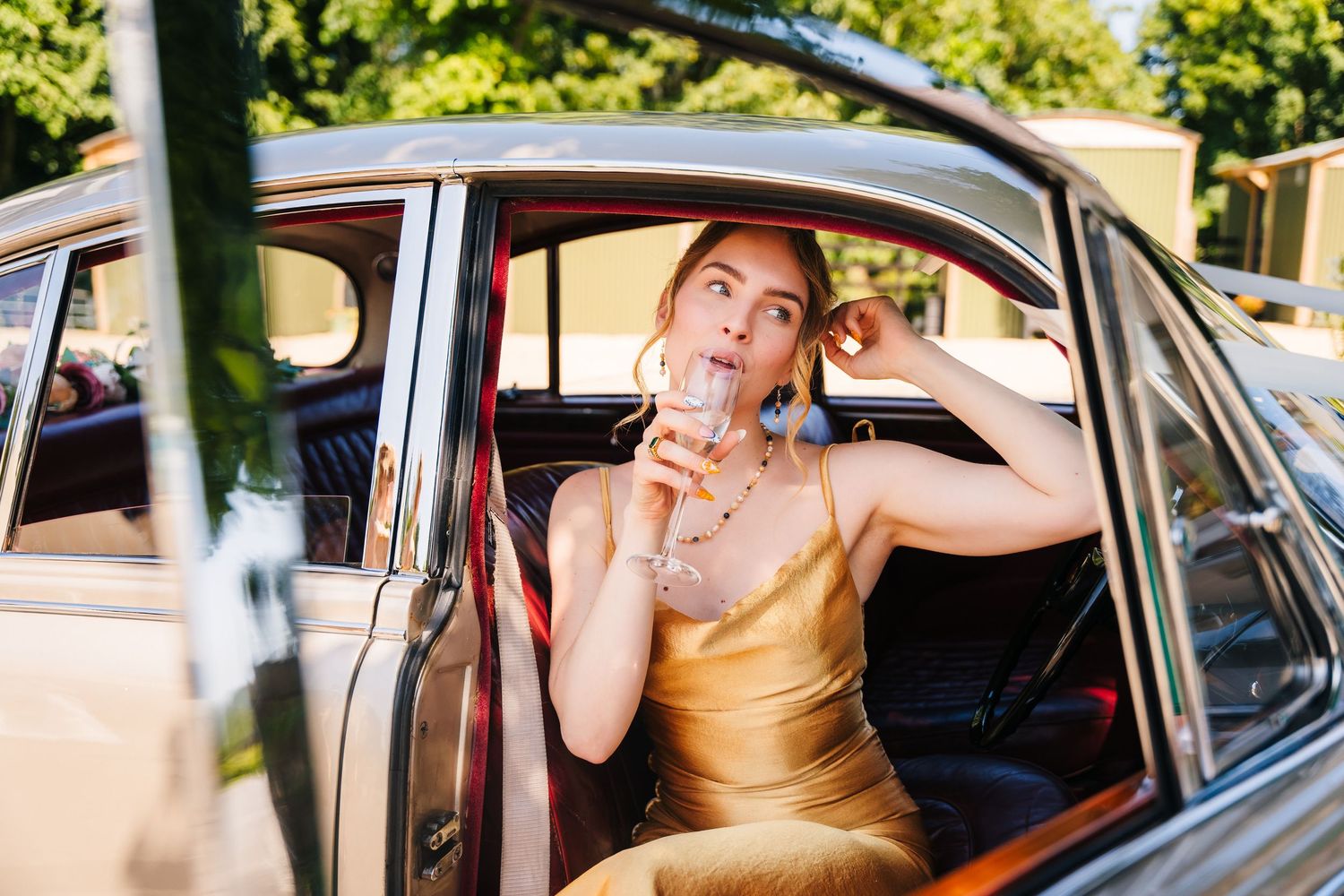 Poulaphouca Wedding photographer wicklow  Multiple candid shots show someone in a gold dress posing playfully inside a vintage car.