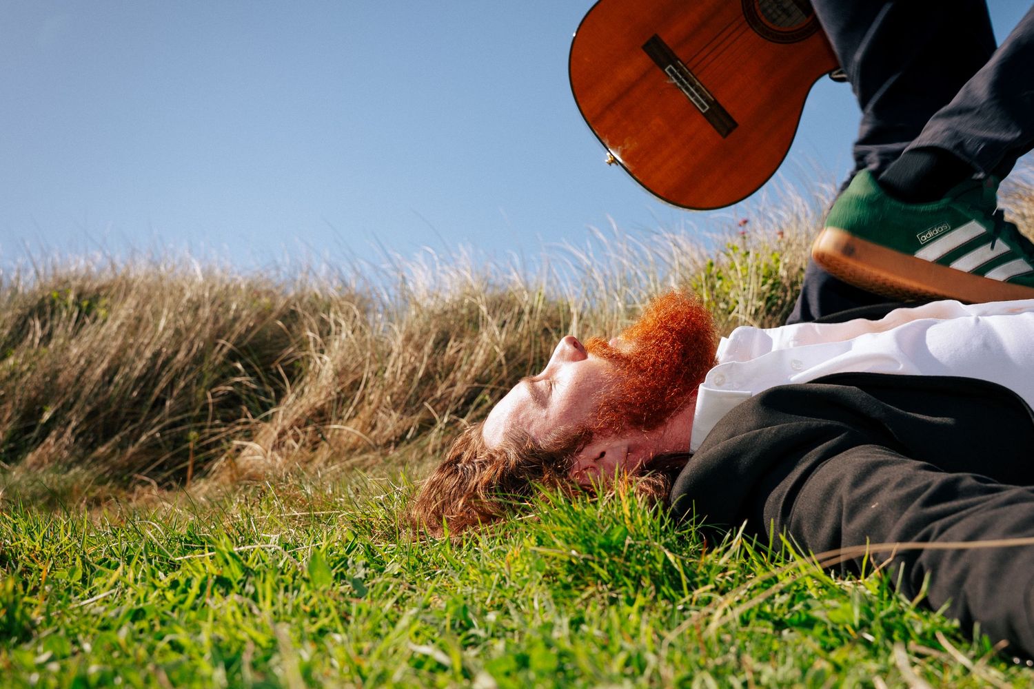 Multiple artistic shots showing close-ups of an acoustic guitar in natural outdoor settings. PHOTOGRAPHER Dublin