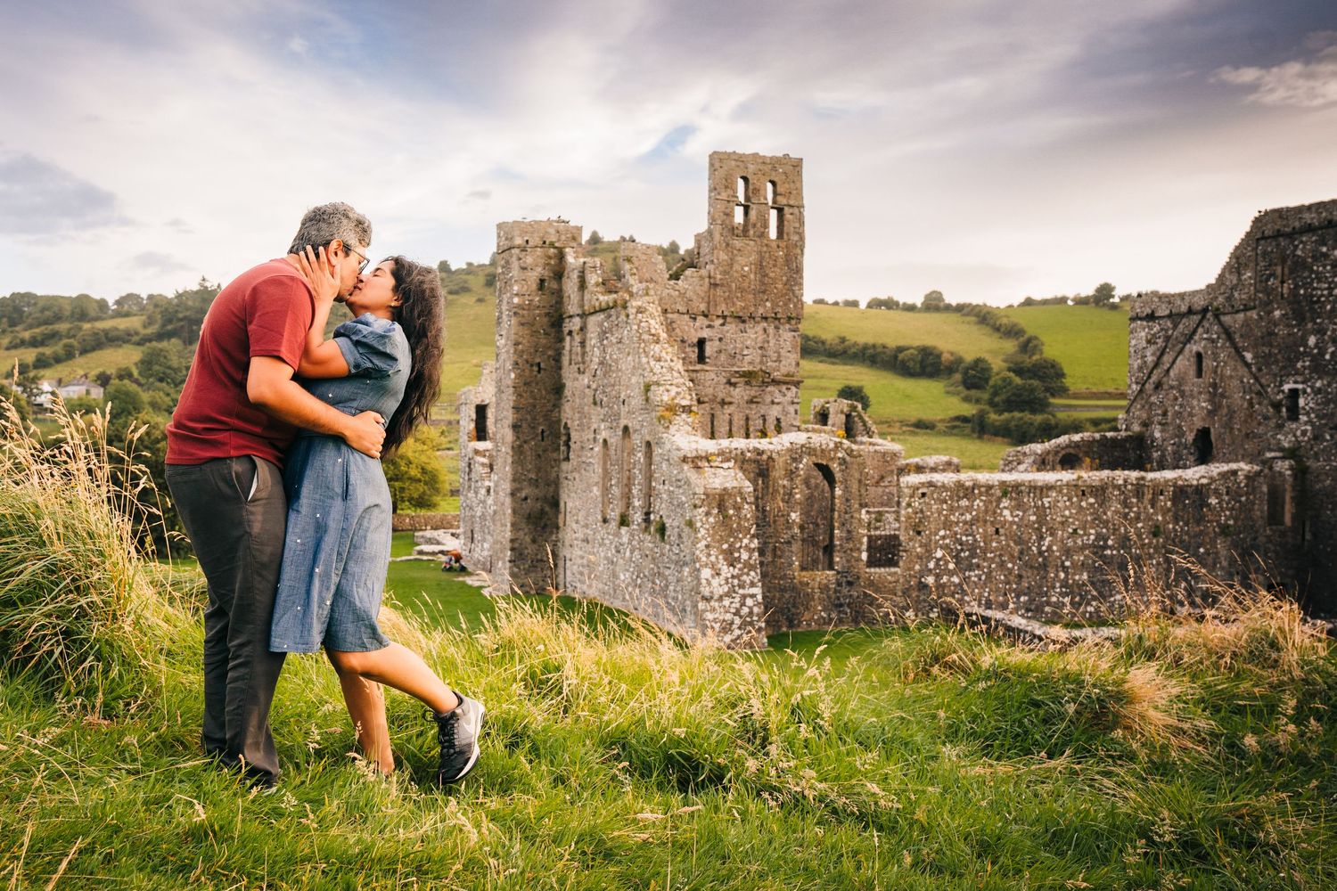A romantic photo series with stone castle ruins in Irish countryside serving as backdrop on a sunny summer day. PHOTOGRAPHER Dublin ireland