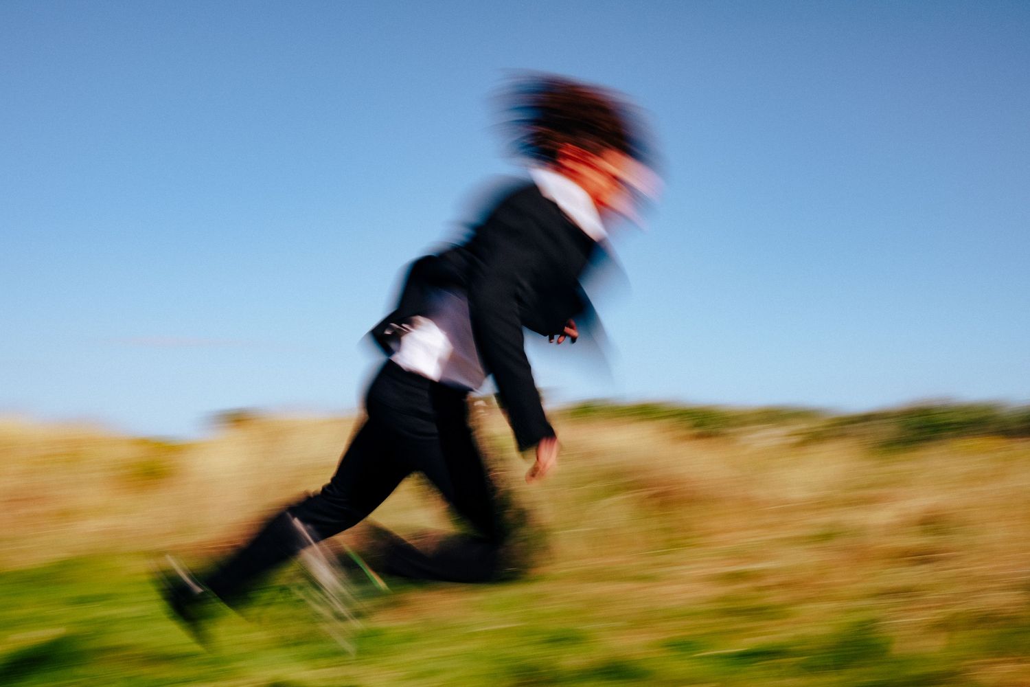 Motion-blurred action shots of someone moving through a grassy landscape. PHOTOGRAPHER Dublin