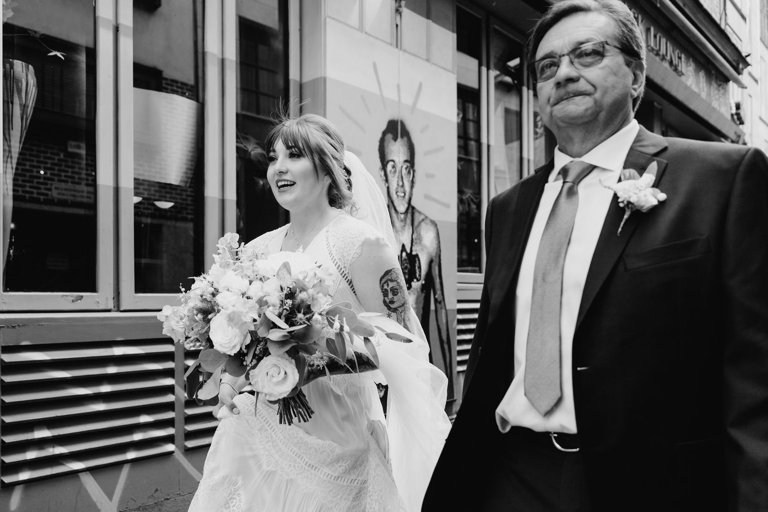 Black and white wedding portrait with urban architecture in background. PHOTOGRAPHER Dublin Ireland Wedding