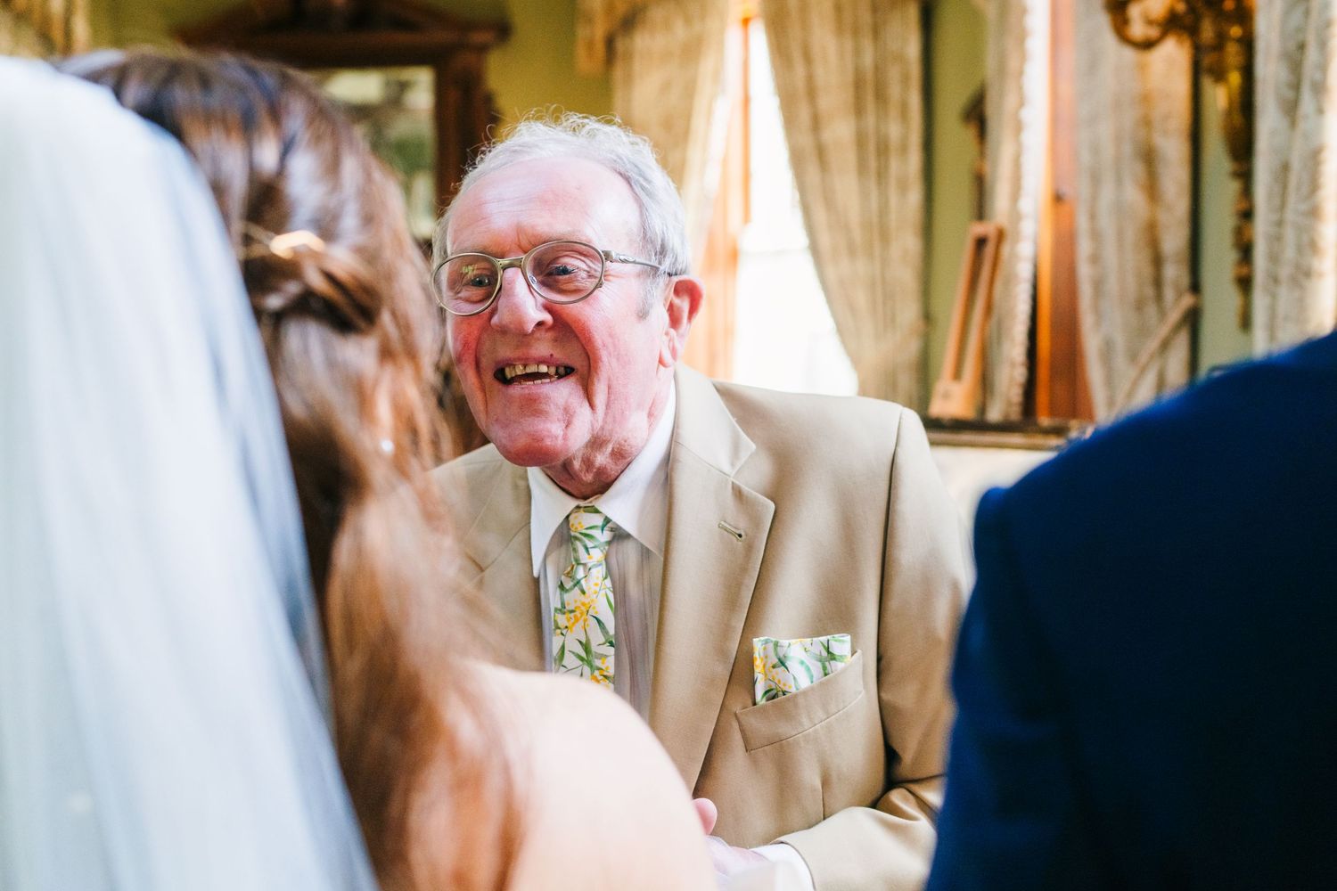 Castle Leslie Wedding Photographer Dublin Candid moment during wedding reception showing joyful emotions and reactions.