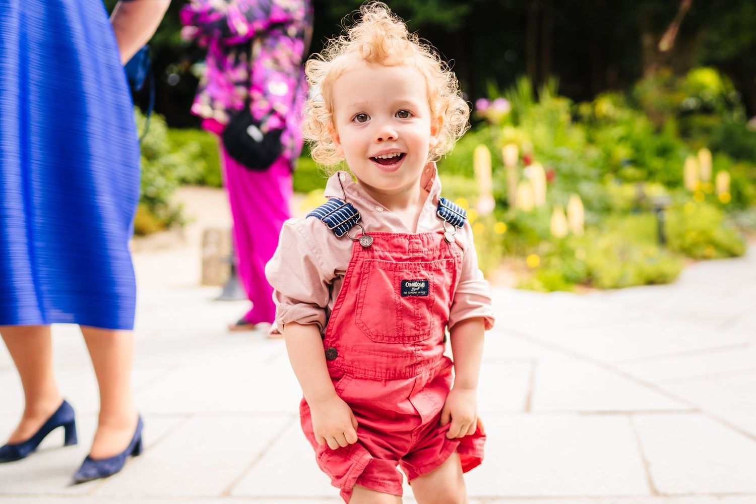 Poulaphouca Wedding photographer wicklow  Children in colorful outfits dance and play during an outdoor celebration.