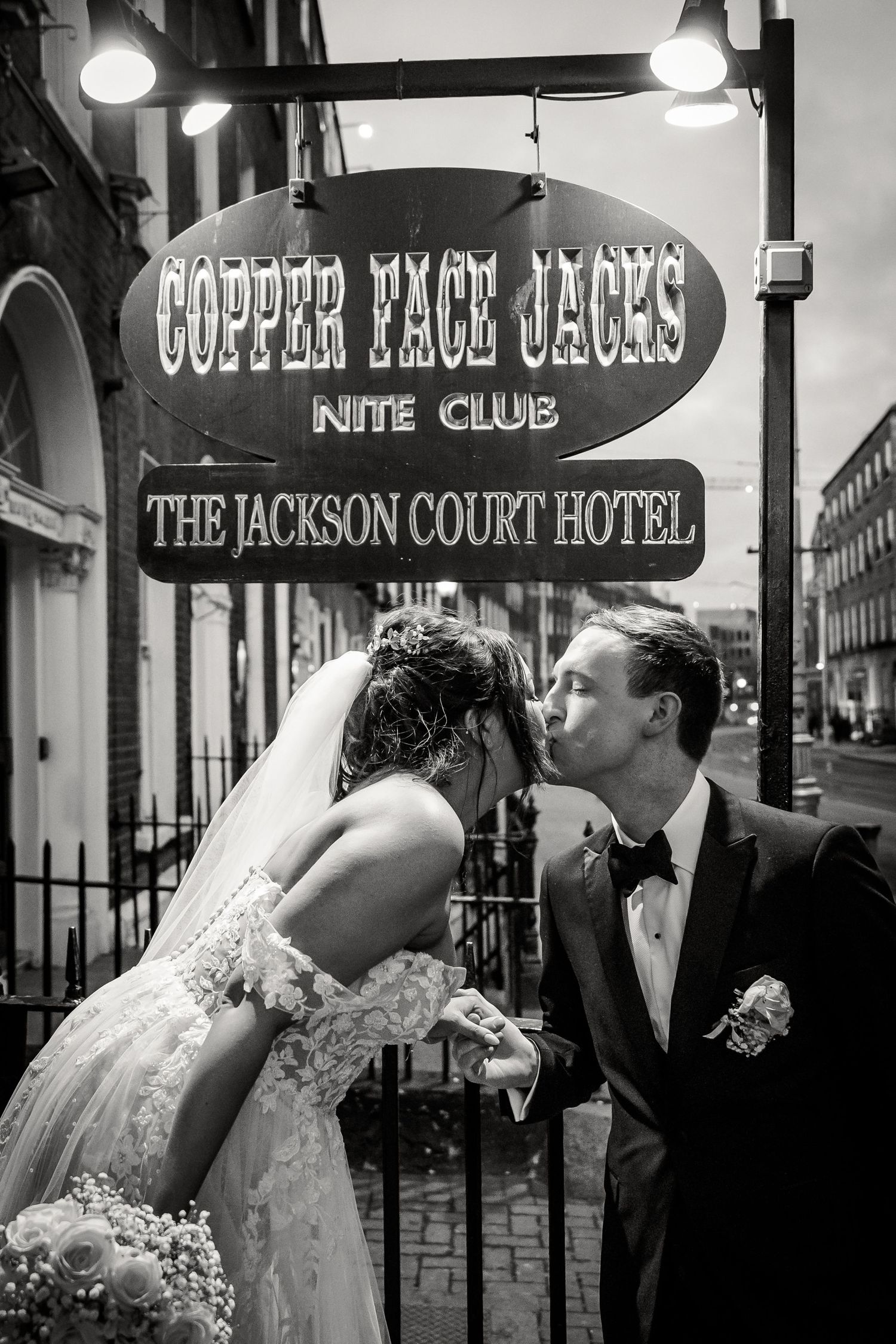 Black and white photos of newlyweds outside The Jackson Court Hotel and Copper Face Jacks. Wedding PHOTOGRAPHER Dublin