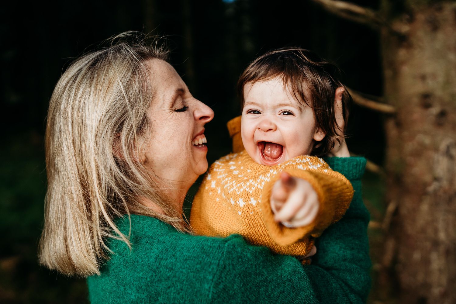 A playful series of photos showing tender moments between people sharing a loaf of bread in warm natural lighting. family PHOTOGRAPHER Dubli