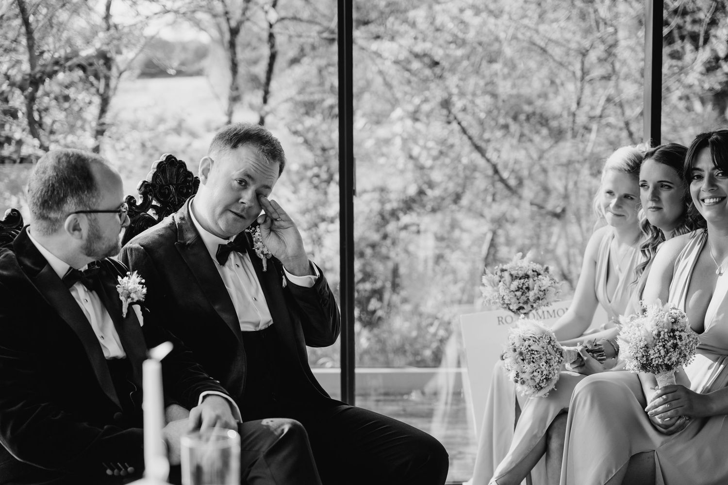 Series of monochrome photos capturing candid moments of wedding guests during an outdoor celebration. Wedding photographer dublin