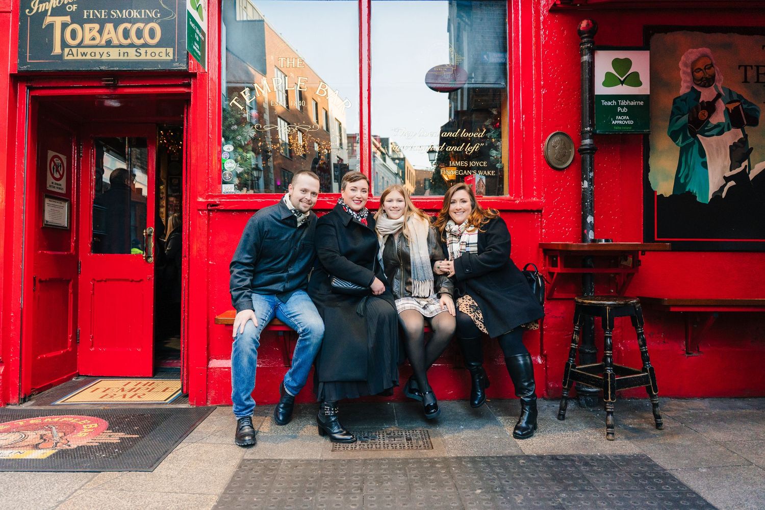 Family walking through Dublin city centre during a relaxed vacation photo session with a family photographer Dublin temple bar
