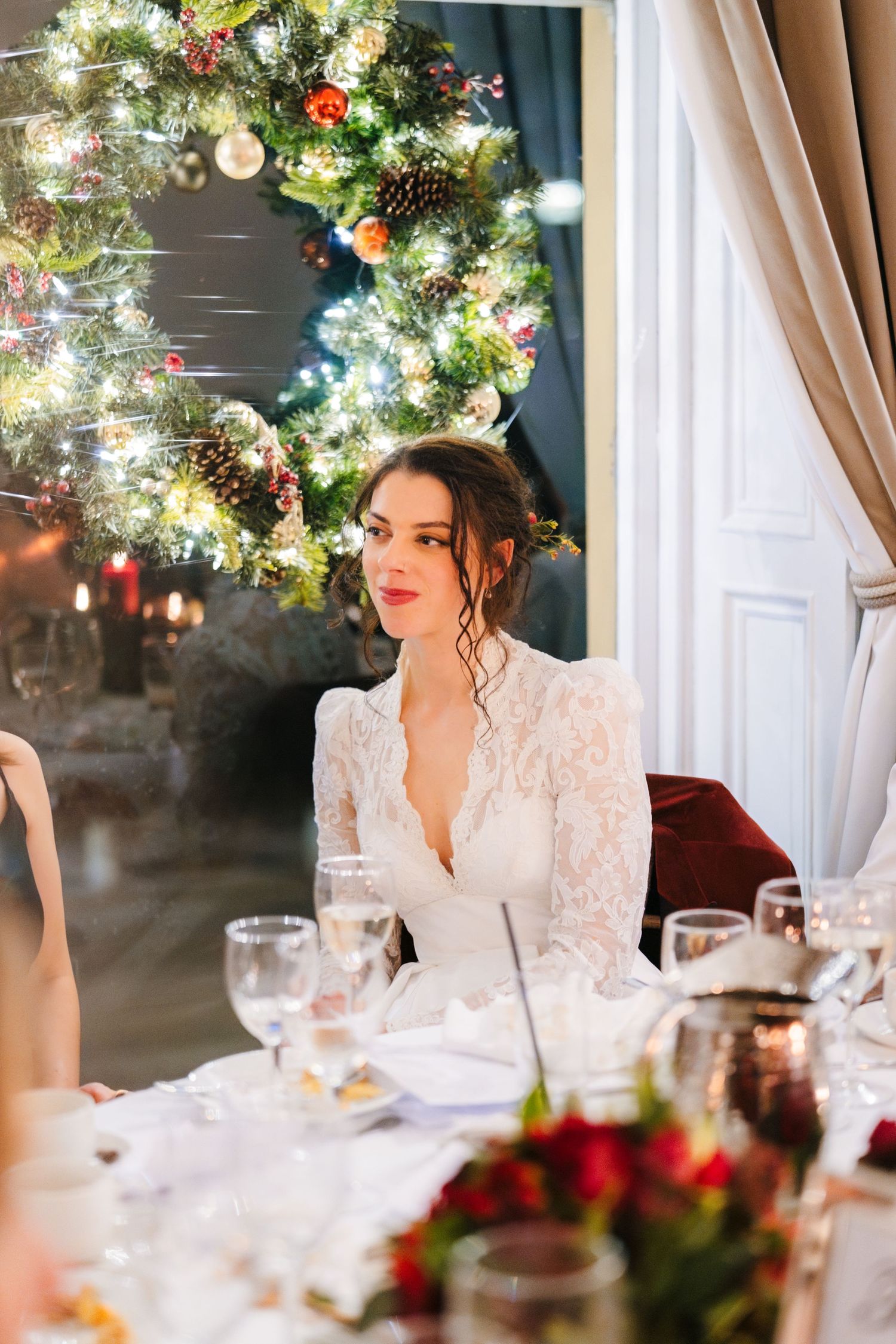 Elegant winter wedding table setting with illuminated Christmas wreath and floral decor. Stephens green club dublin Wedding photographer