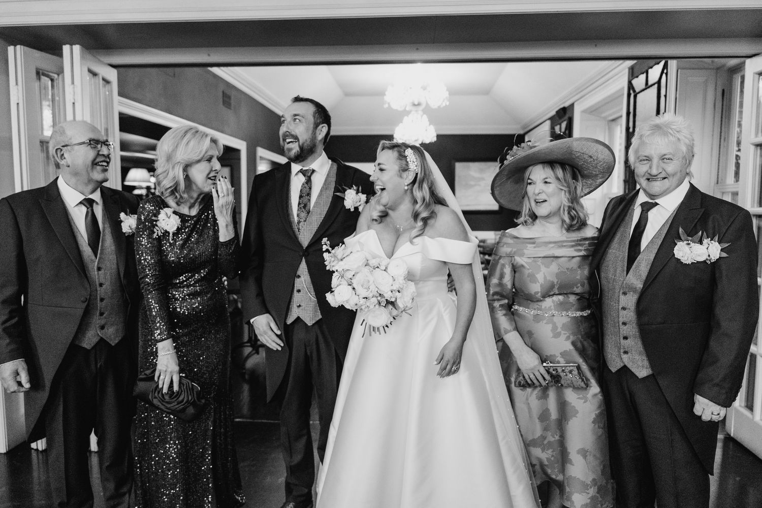 Wedding guests celebrating in a classic reception venue with traditional decor.  Virginia Park Lodge Wedding Photographer Cavan Dublin Irela