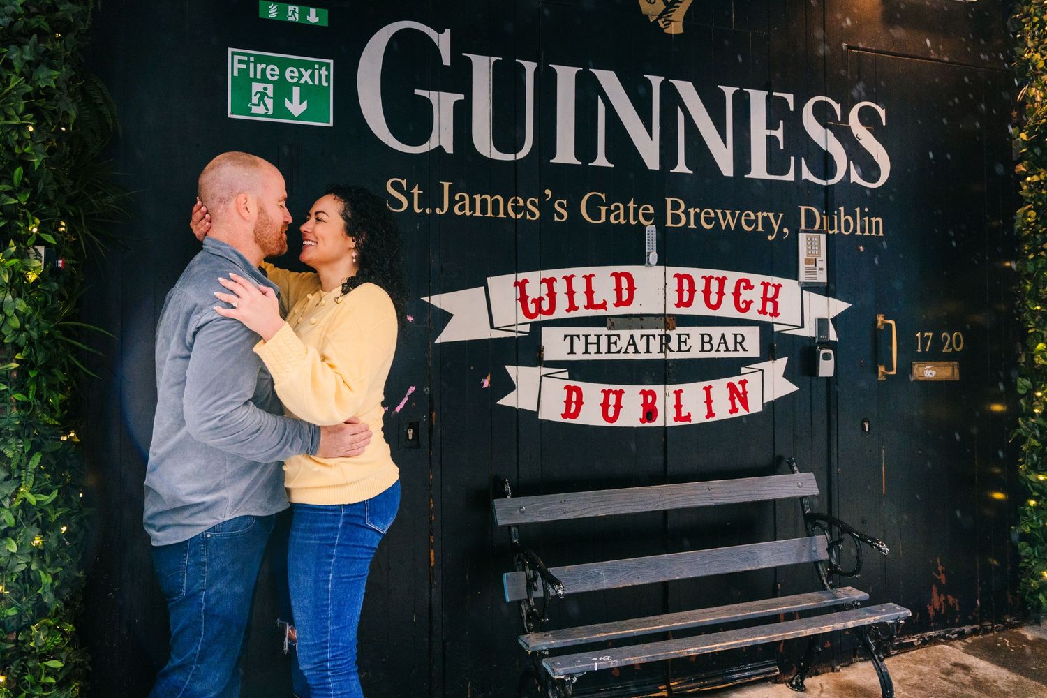 A couple shares a romantic moment outside the Guinness St. James's Gate Brewery in Dublin. Proposal Dublin Photographer