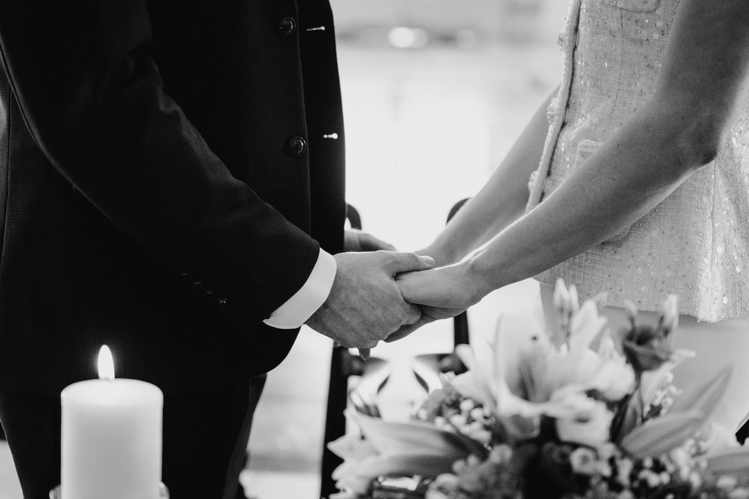 Wedding ceremony details including candle lighting and ring exchanges in an elegant setting. City Hall Dublin wedding photogrAPher