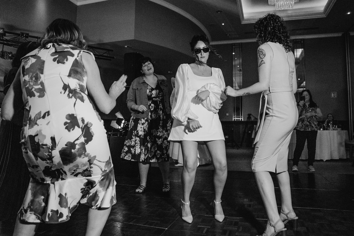 Black and white photo of wedding guests dancing at reception.Wedding Photography Trim Castle Ireland