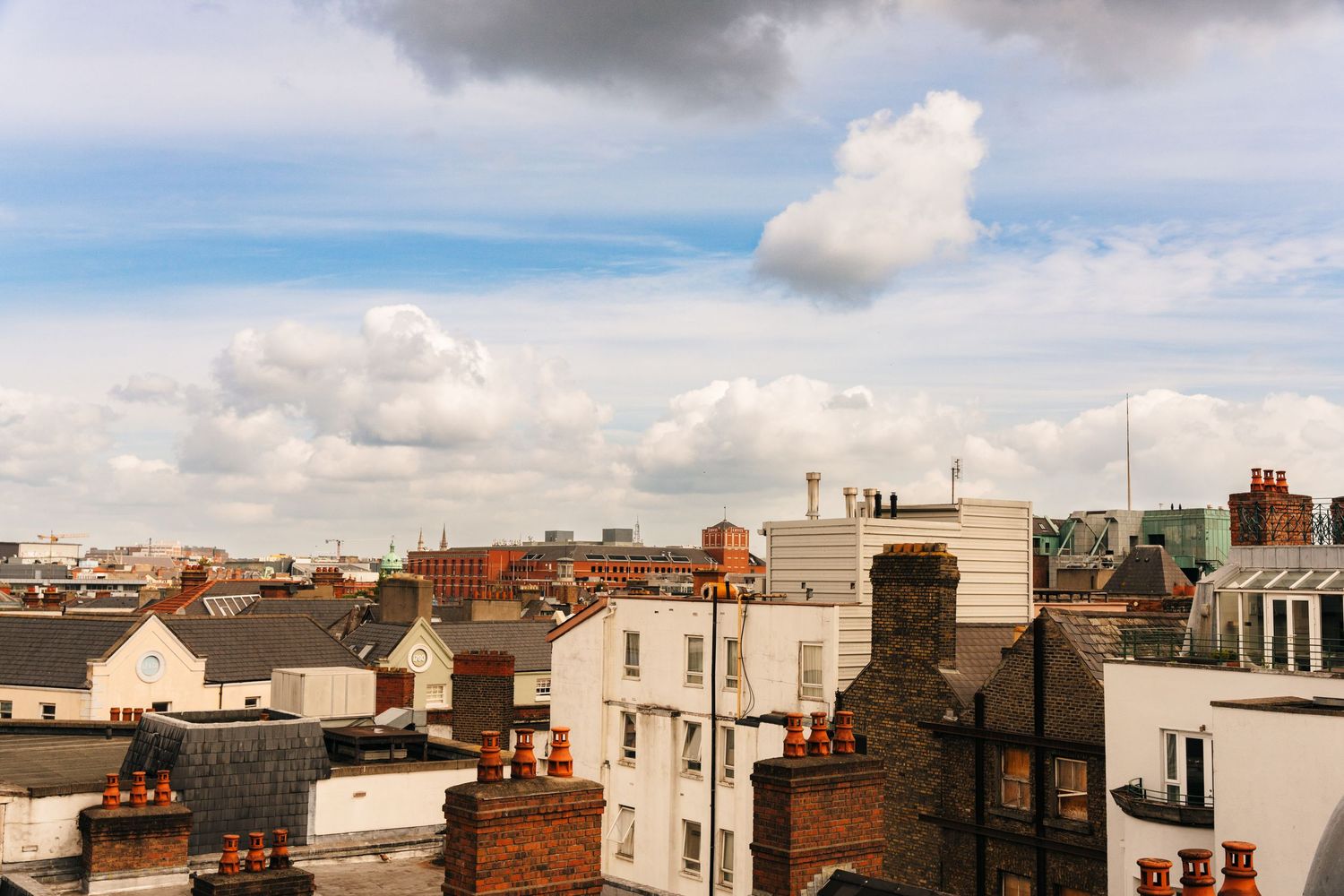 Panoramic cityscape view of Dublin rooftops and buildings under cloudy skies. PHOTOGRAPHER Dublin Ireland Wedding