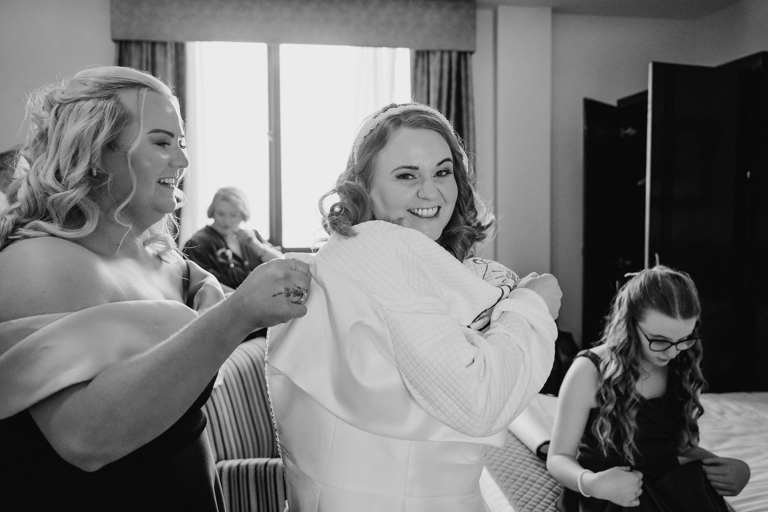 A series of black and white candid getting ready moments on a wedding day.  Wedding PHOTOGRAPHER Trim Castle